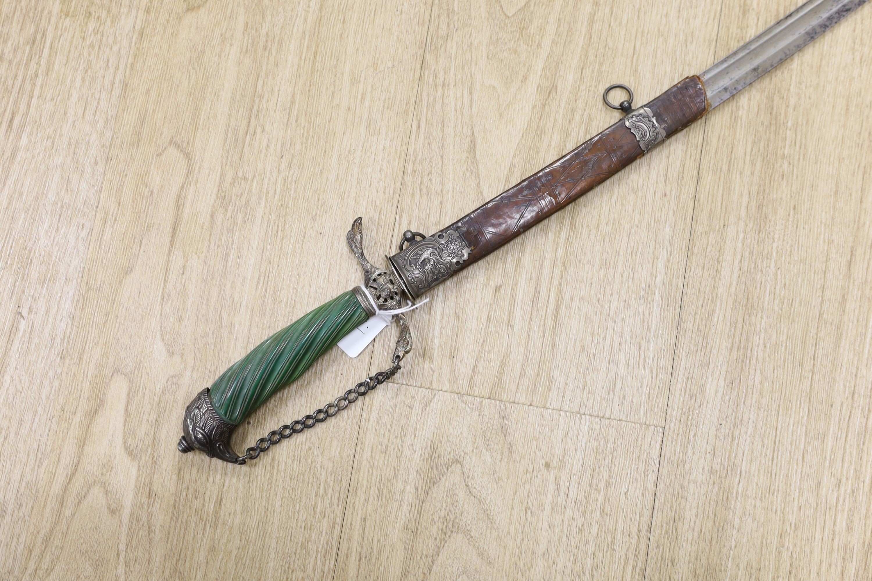 An English silver hilt hanger c.1770, London, maker M.B (year letter indistinct) eagle head pommel and crosspiece finials, spiral carved, green-stained ivory grip, curved fullered blade 63cms, retaining the top of its si